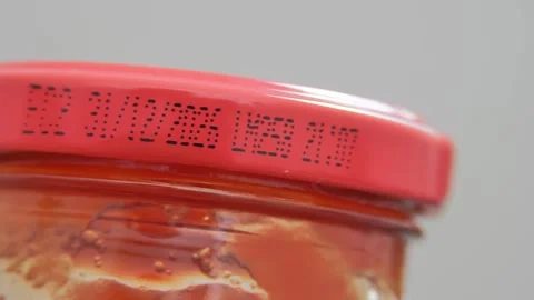 Close-up of a cap with an expiration date. The concept of food security Stock Footage 255247259