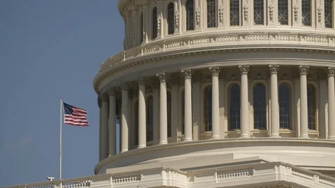 Close Up on the Capitol Building With the American Flag in Slow Motion Stock Footage 88733103
