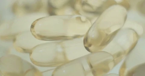 Close-up of capsules with oil Stock Footage 81791488