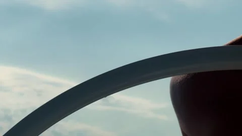 Close-up of a captain steering a ship at sea on a sunny day. Stock Footage 317551146