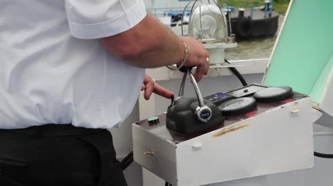 Close up of captain steering ship's helm on deck 스톡 동영상 55107139
