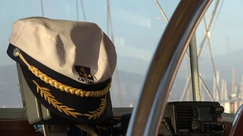 Close up Captains cap on the wheelhouse console Stock Footage 112276512