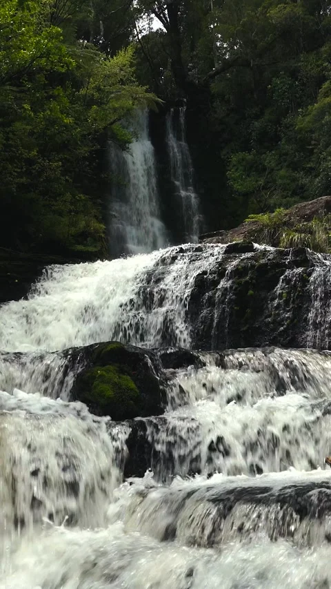 Close up caption of water coming down from beautiful waterfall in the middl.. Stock Footage 288496420