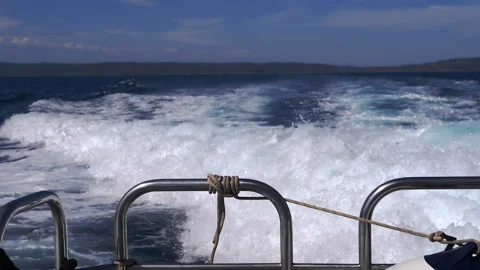 Close up, Captivating Boat Wake on Ocean Waves Stock Footage 313872112