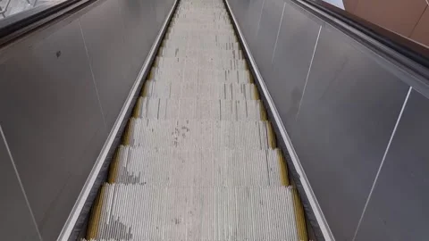 A close-up capture of escalator steps in a modern structure 動画素材 323010195