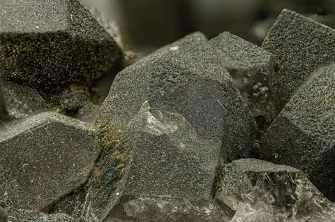 This close-up captures the distinctive, deep green crystals of prase quartz.. Foto stock