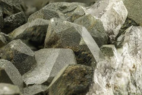 This close-up captures the distinctive, deep green crystals of prase quartz.. Fotos Stock