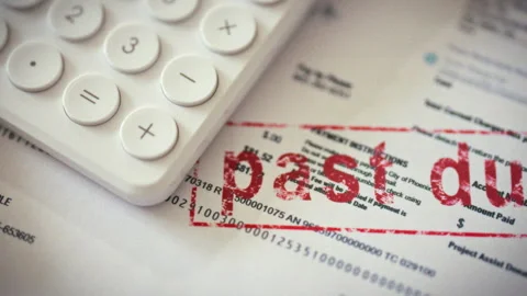 A close-up captures a red expired seal stamped on a utility bill with nearby Stock Footage 338185700