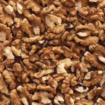 Close-up capturing a plentiful amount of shelled walnuts Stock Photos