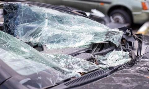 Close-up of a car with a broken windshield after a fatal crash. Consequence o Stock Photos