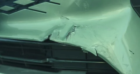 Close-up of car damage after a traffic collision, illustrating the auto Stock Footage 325653304