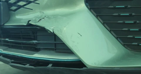 Close-up of car damage after a traffic collision, illustrating the auto Stock Footage 325653317