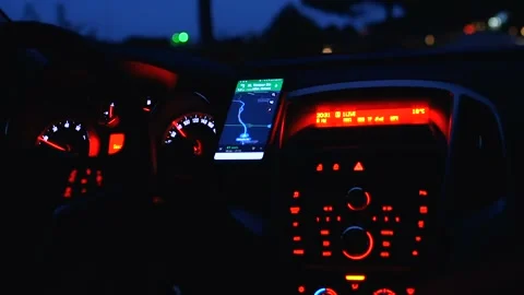 Close-up of car dashboard, control panel with speed gauge, fuel consumption, han Stock Footage 104946887