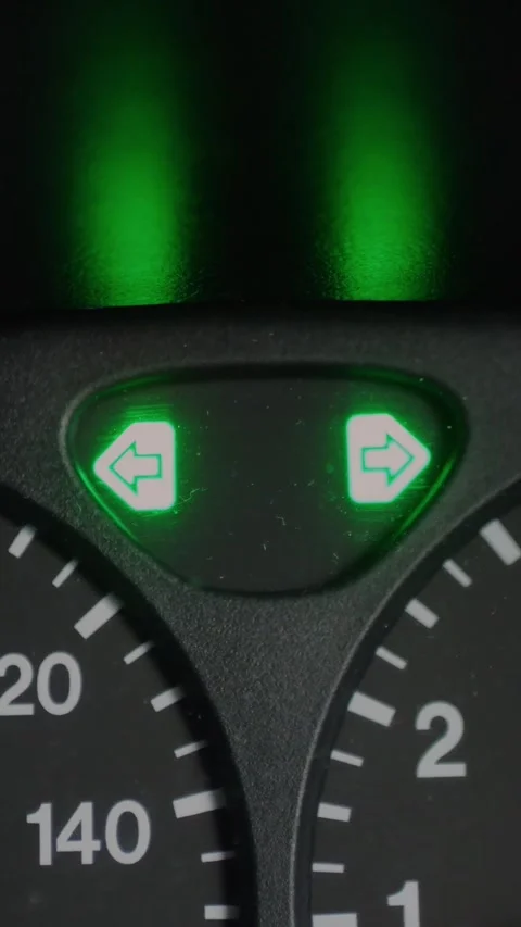 Close-up of car dashboard displaying illuminated green turn... Stock Footage 344455321