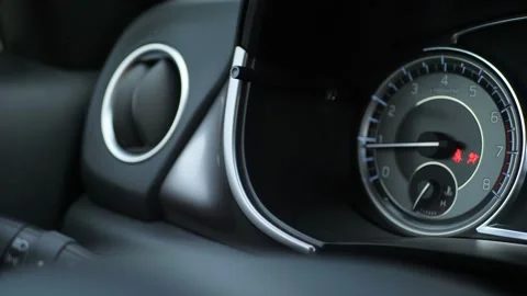 Close up of car dashboard with an engine speed dial and tachometer Stock Footage 143376110