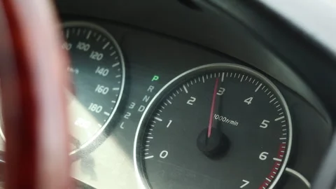 Close up of car dashboard with flashing lights and the engine revving Stock Footage 321524489