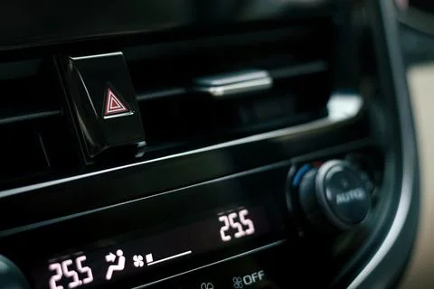 Close-up of car dashboard, hazard flasher switch or emergency light button Stock Photos