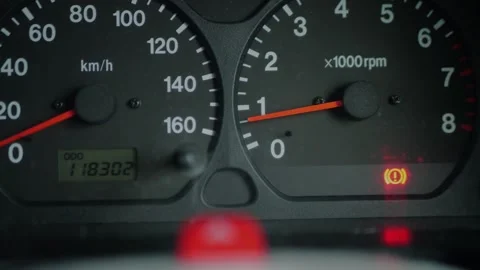 Close-up of car dashboard with red brake warning light illuminated... Stock Footage 339101531