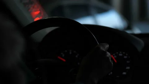 Close-up, car dashboard, steering wheel. The female hand is driving. 4K Slow Mo Stock-Footage 103587164