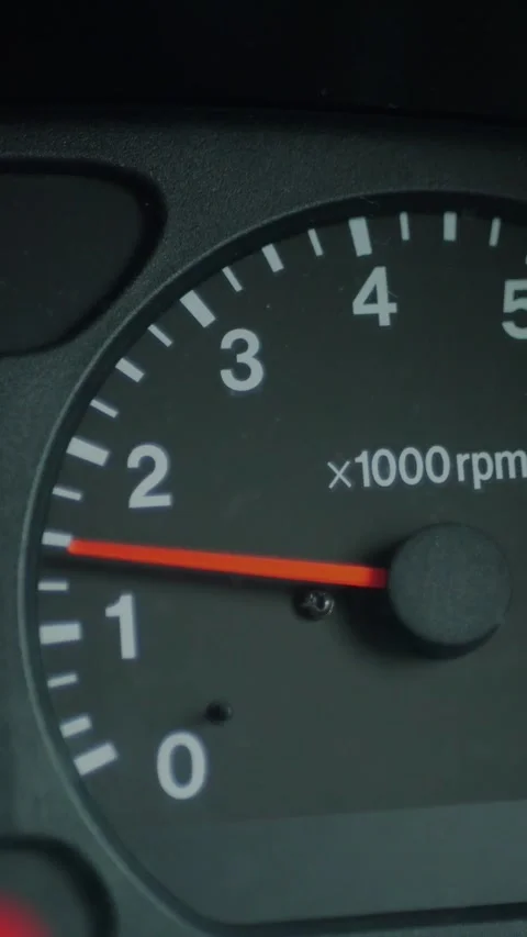 Close-up of a car dashboard with the tachometer needle RPM... Stock Footage 344455301
