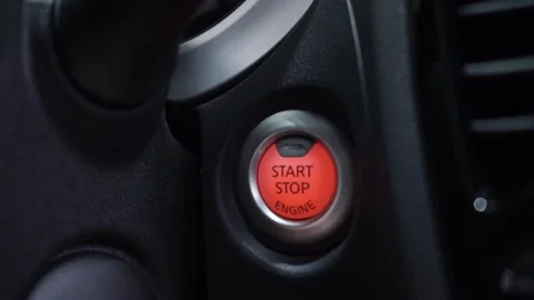Close up for car driver starting the engine of the modern vehicle, modern techno Stock Footage 169029674