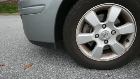 Close up car driving on road at park with 4k resolution Stock Footage 140969132