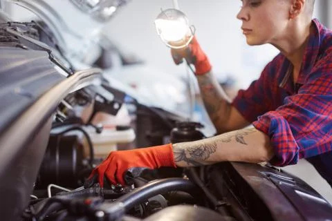 Close up of a car electrician looking for a problem. Stock Photos