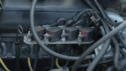 Close-up of car engine bay showing ignition coils and wiring. Stock Footage 341136995