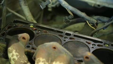 Close-up of car engine block showing cylinder head and gasket Stock-Footage 312845957