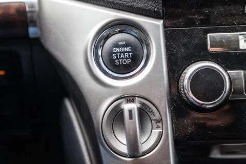 Close-up car engine ignition start and stop button on the dashboard, electric 스톡 사진