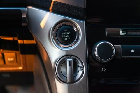 Close-up car engine ignition start and stop button on the dashboard, electric 스톡 사진