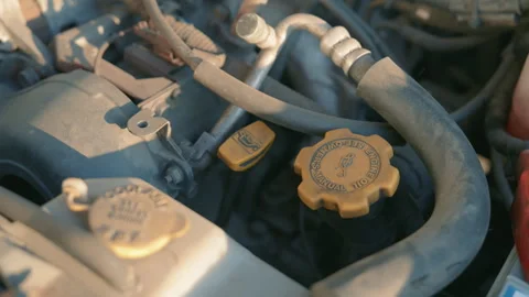 Close-Up of Car Engine Oil Cap Under Hood with Dipstick | Rotating Camera Shot Stock Footage 340536036