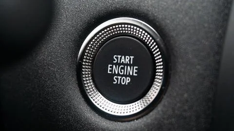 Close-up Car Engine Start Stop Button with Illuminated White Text on Black .. Stock Photos