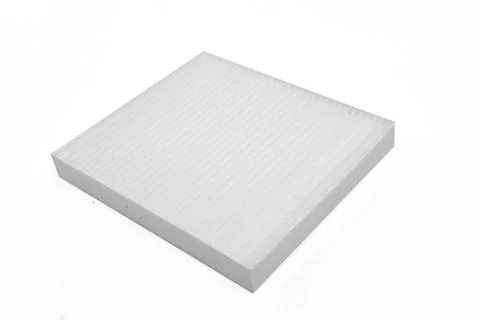 Close-up on a car filter for a white engine as a background with vertical str Stock Photos