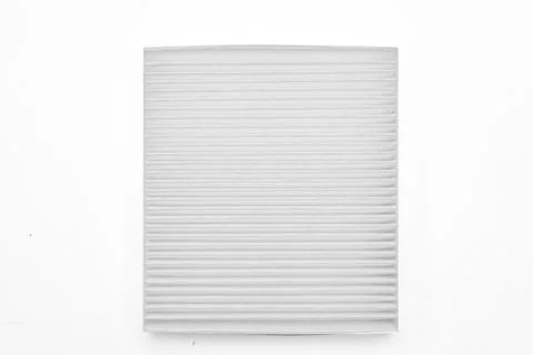 Close-up on a car filter for a white engine as a background with vertical str Stock Photos