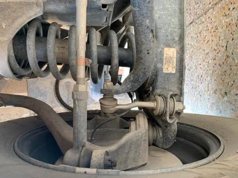 Close up of Car Front Axle Shocker and Tyre. Stock Photos