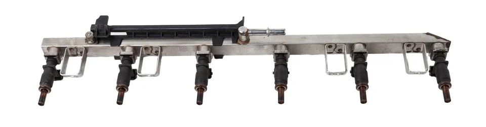 Close-up on a car fuel rail with injectors for supplying gasoline to a six-cy Stock Photos