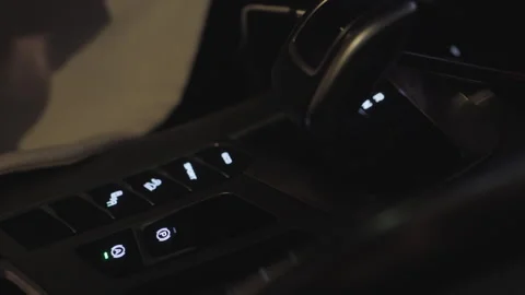 Close up of car gear selector and control buttons in modern interior Video stock 307788412