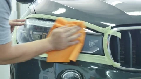 Close up car lamp or front headlight polishing, renewed headlamp Stock Footage 68504978