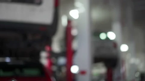 Close-up of car mechanic hands returning keys to vehicle owner after repair in a Stock Footage 189368344