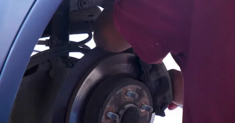 Close up Car Mechanic man hands repairing car auto repair shop. Man hands fixing Stock Footage 288787606