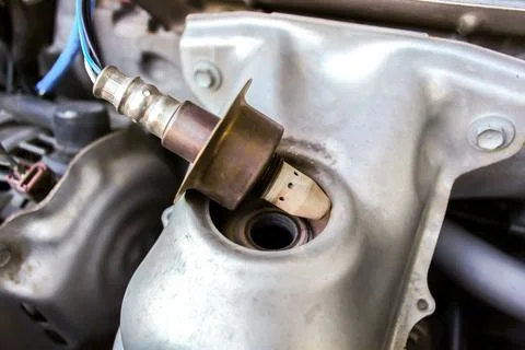 Close-up of a car oxygen sensor or O2 sensor being removed or installed Foto stock