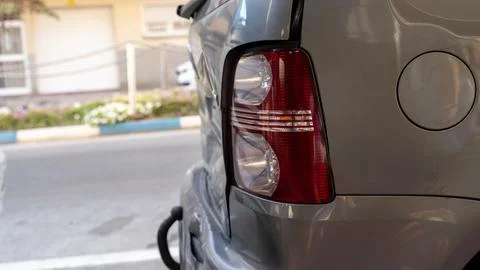 Close Up of Car Rear Tail Light and Fuel Cap Parked Outdoors Stock Photos