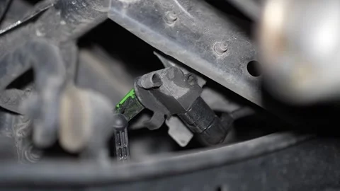 Close-up of a car ride height sensor on vehicle chassis. Stock Footage 345707459