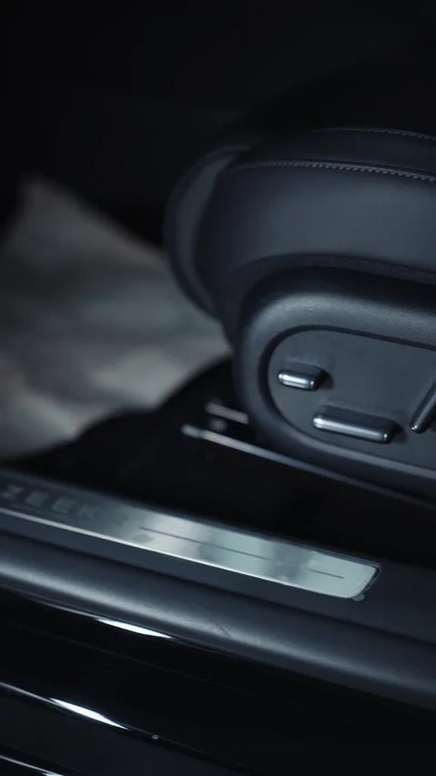 Close-up of car seat adjustment controls in modern vehicle Vídeos de archivo 318444424