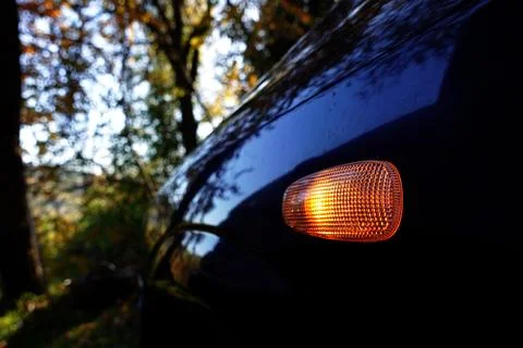 Close-Up of Car Side Marker Light with Autumn Reflection Stock Photos