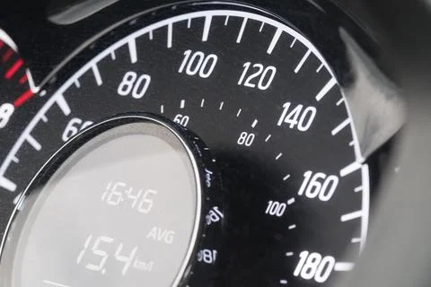 Close-up of car speedometer with digital display showing average speed and ti Stock Photos