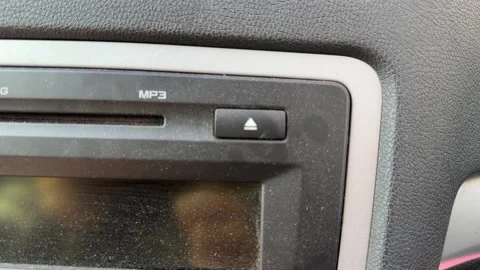 Close up of car stereo CD slot and dashboard media system, in vehicle audio Stock Footage 337120822