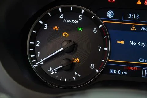 Close up of car tachometer with warning indicators Stock Photos