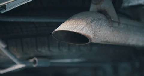 Close up of car tail pipe emitting clear emissions and exhaust Stock Footage 102927976